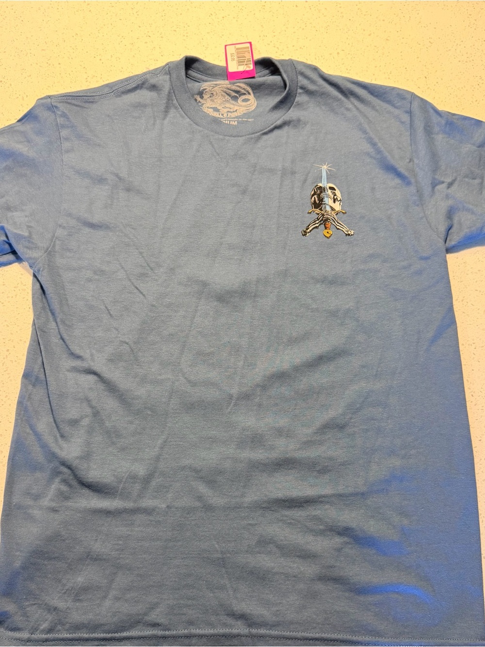 Light Blue Short Sleeve Tee with Small Chest Skull Graphic